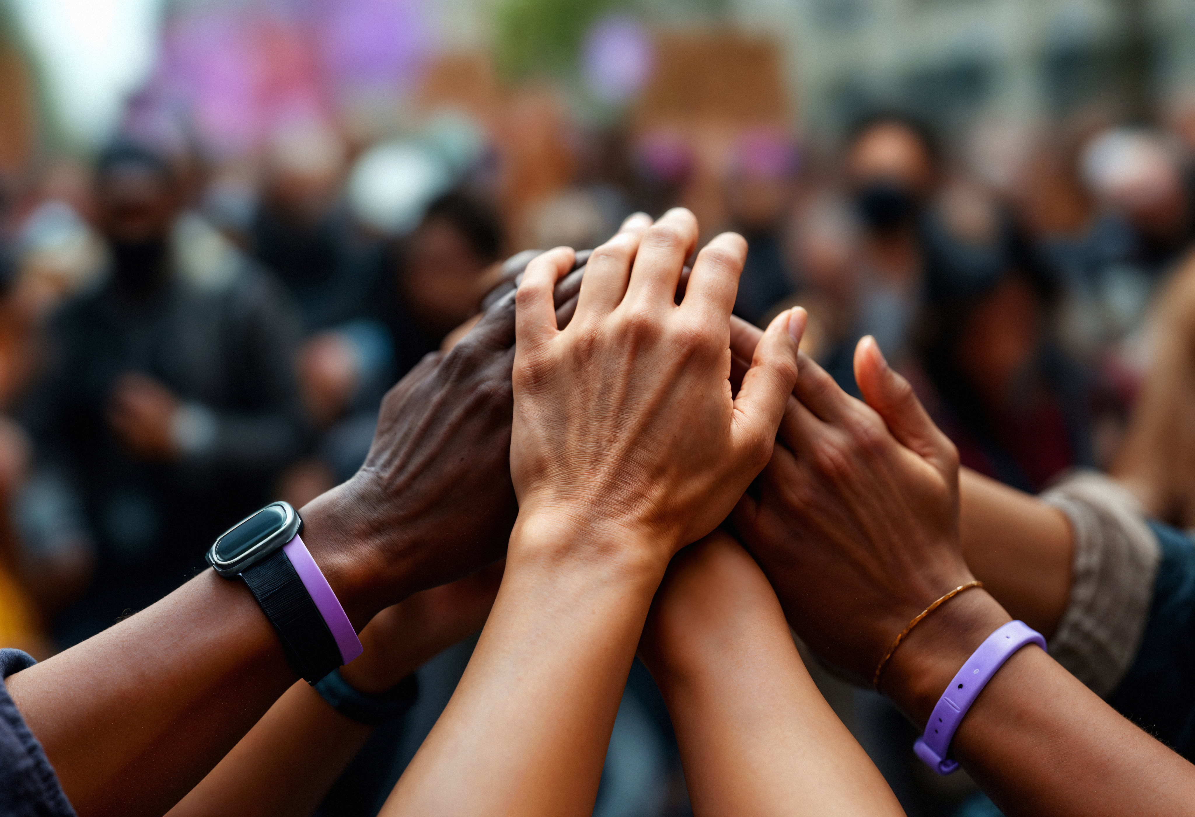 Diverse hands joined together — community, unity, togetherness across Africa
